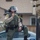 In this photo taken at a 2016 protest, a Los Angeles County Sheriff’s deputy in riot gear stands ready to use a sound cannon, or long-range acoustic device (LRAD), against demonstrators near a Donald Trump campaign rally in Anaheim, California.